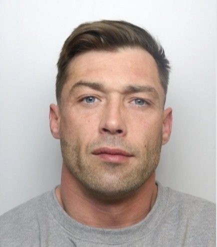 The mugshot of Jonathan Cahill has attracted thousands of comments