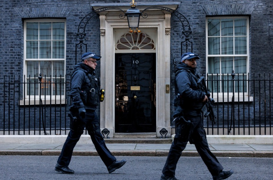 Police officers patrol outside 10 Downing Street