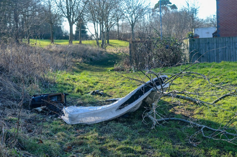 A discarded mattress on the grass, which is often burnt by deliberately started fires