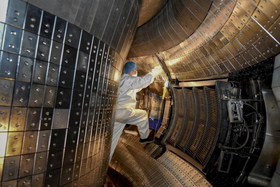 Researchers working inside the Experiential Advanced Superconducting Tokamak in Anhui