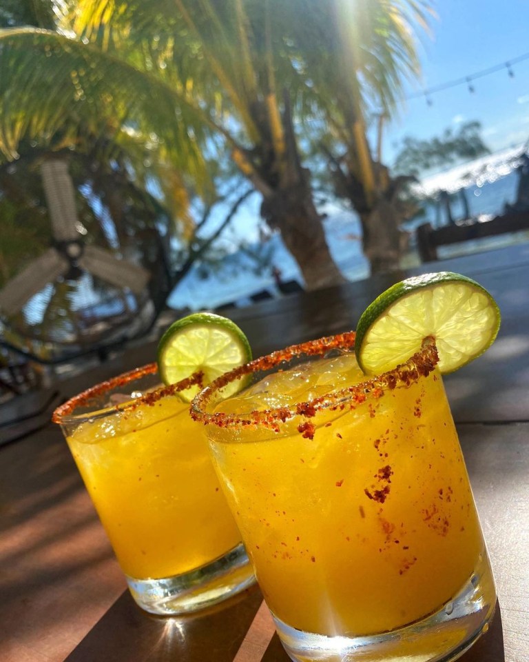 The star sipped cocktails at a beach bar