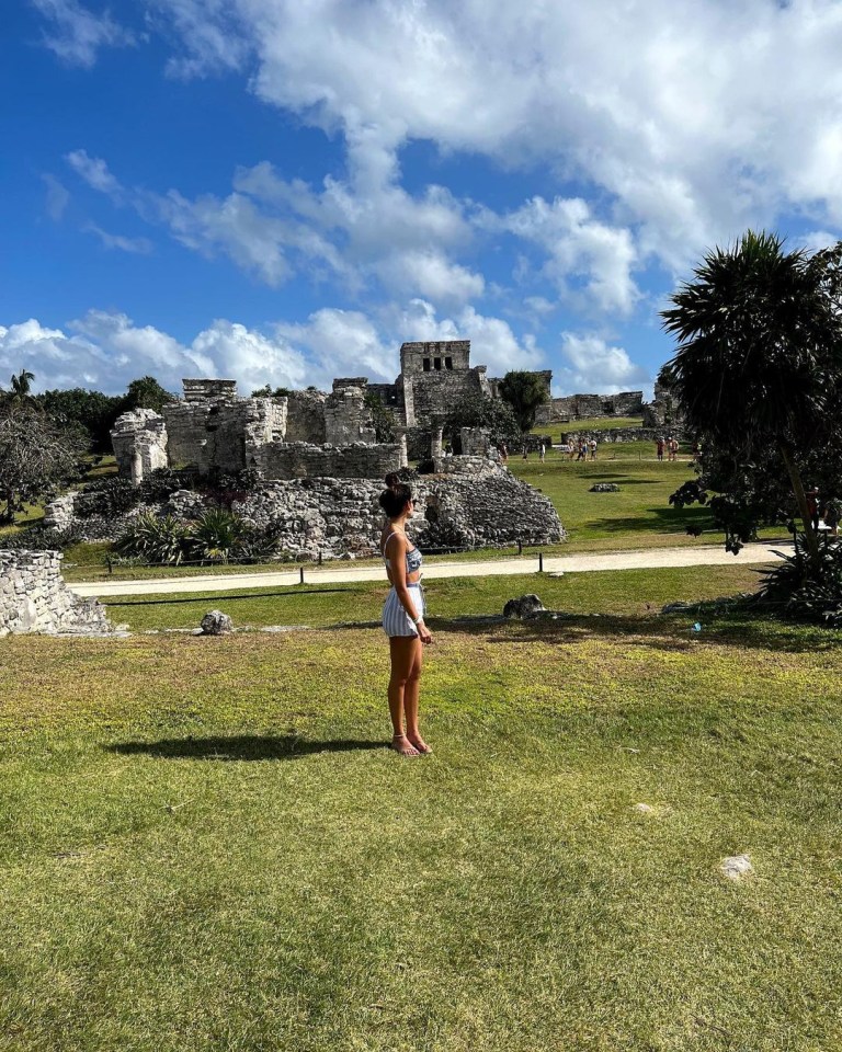 Michelle poses in front of Mayan ruins