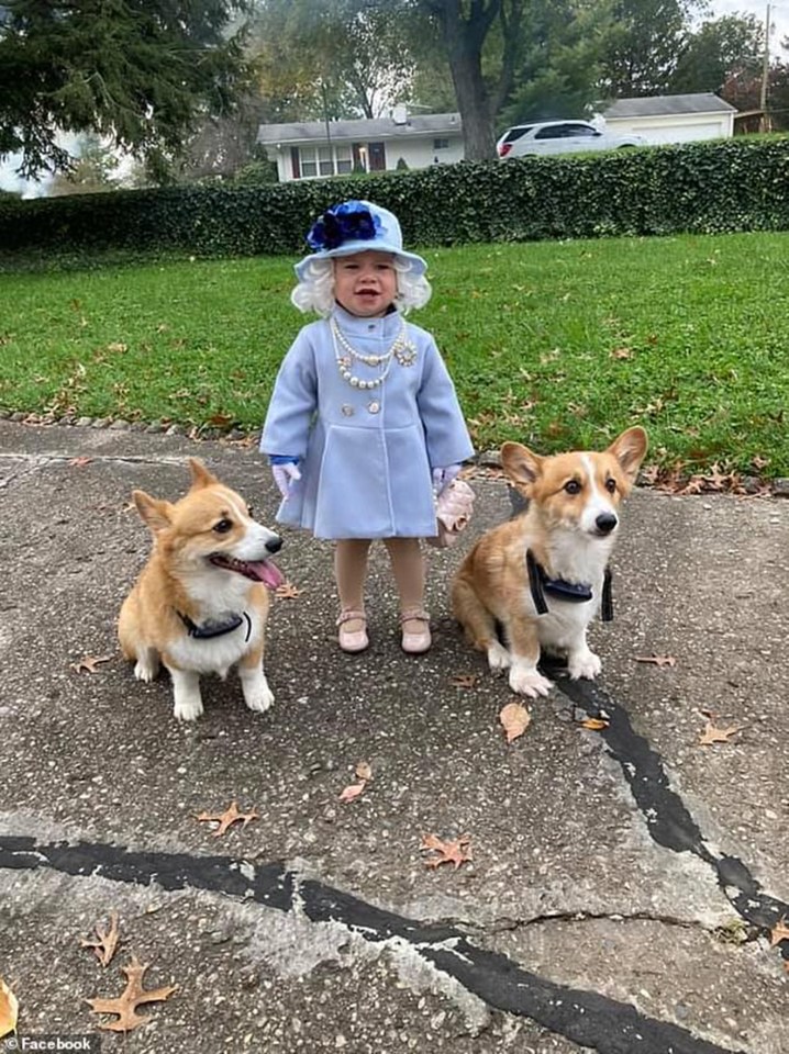 The little girl wore the queen costume alongside two Corgis