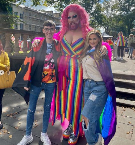 Luke posed with a drag queen at Pride