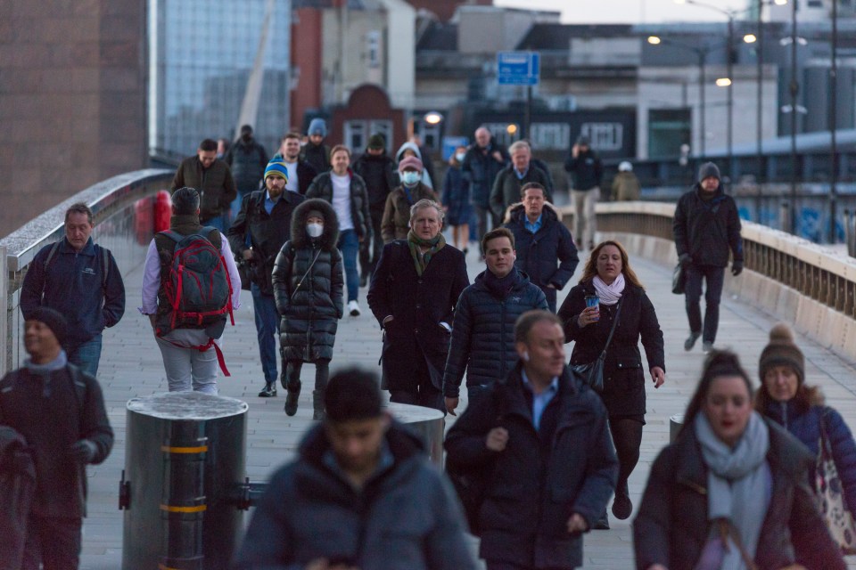 Morning commuters crossing London Bridge