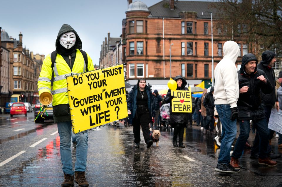 The First Minister says face coverings are a 'small price to pay' to keep Covid under control - in spite of opposition from critics