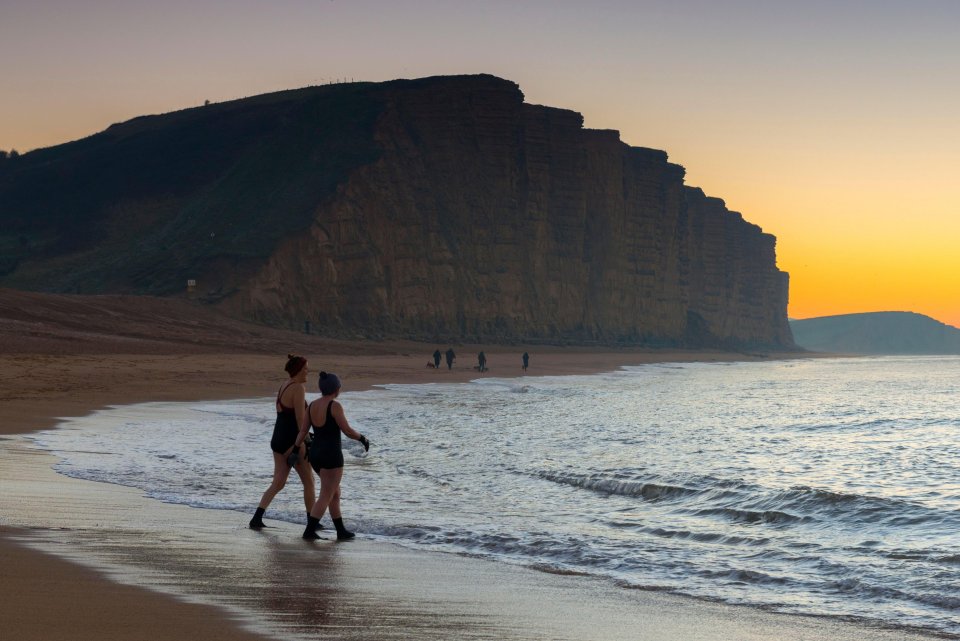 The chill didn't stop these brave friends taking a dip at Dorset's West Bay early this morning