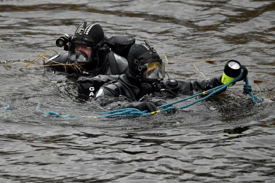 The police water unit continue to search the murder scene