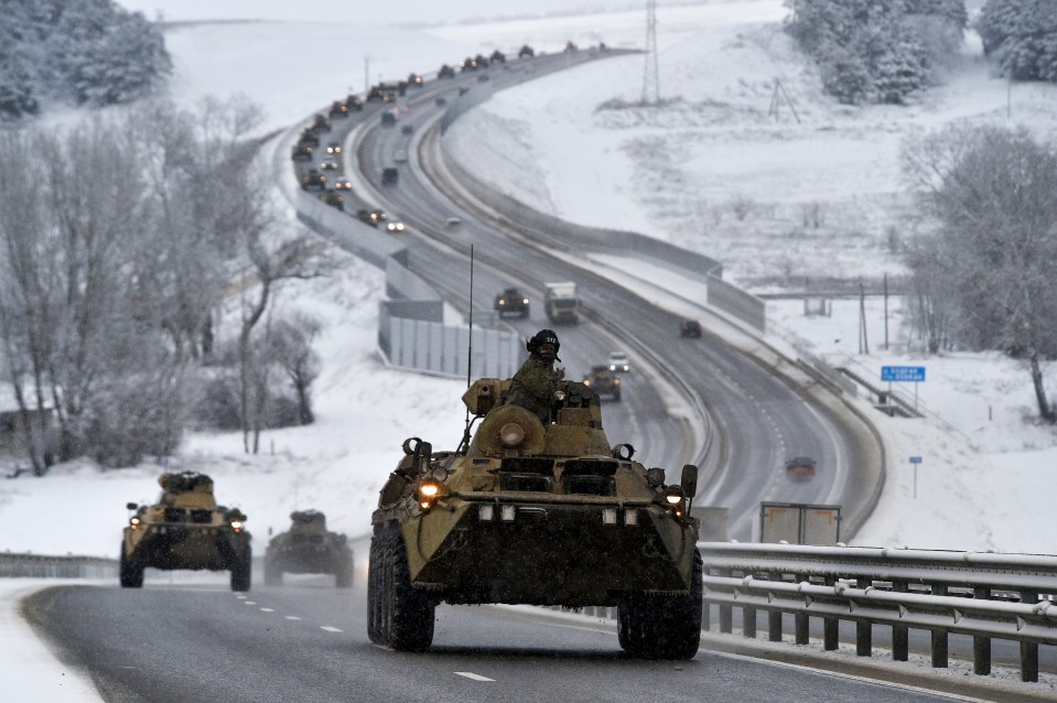 A Russian armoured convoy moves through Crimea down the highway