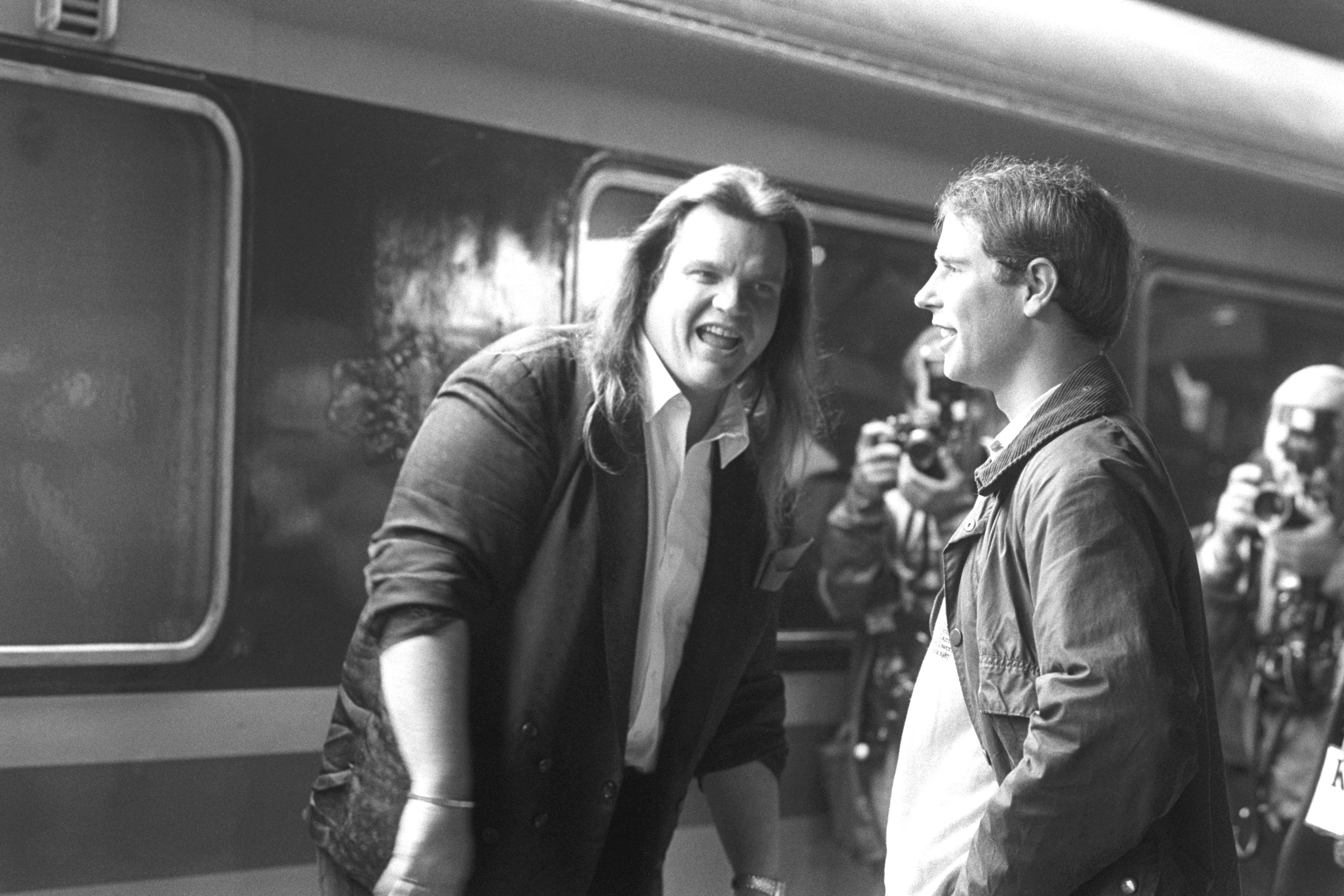 Meat Loaf greeted at Stafford railway station by Prince Edward for rehearsals of the Grand Knockout Tournament in 1987