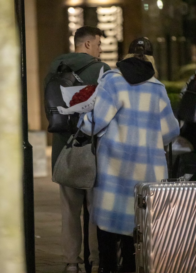 The dancer looked cosy alongside Kai, 26, as they checked into a hotel during the show’s annual tour