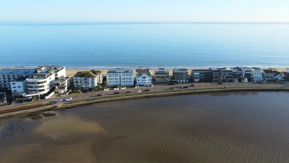 It sits on the 'panhandle' of the peninsula and looks out over Poole Harbour to the front with the sandy beach and the sea behind it