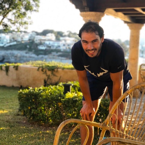 a man wearing a t-shirt that says ' rafa ' on it