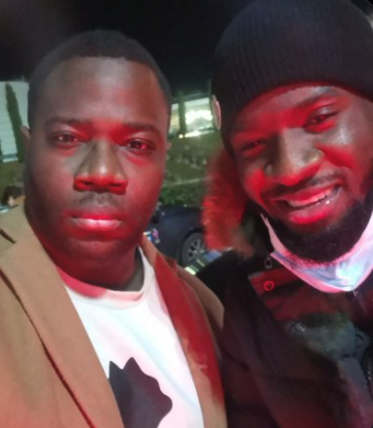 Tanguy Ndombele (right) took time to pose with fans after touching down in Lyon