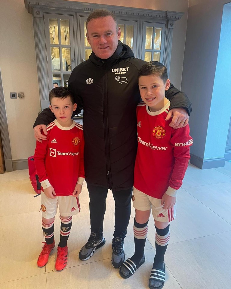 Proud Wayne Rooney poses with Kit and Kai