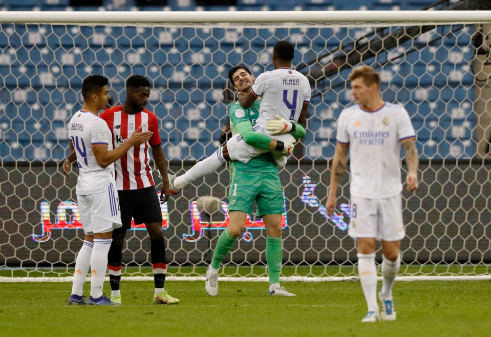 Courtois' team-mates celebrated with him at full-time