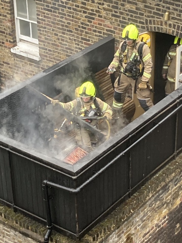 Firefighters were seen battling the blaze on the balcony