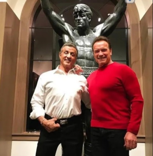 Sylvester with Arnold Schwarzenegger and Sly's Rocky statue