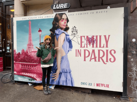 Actress Lily Collins has hit out at vandals after a poster for her show Emily in Paris was defaced