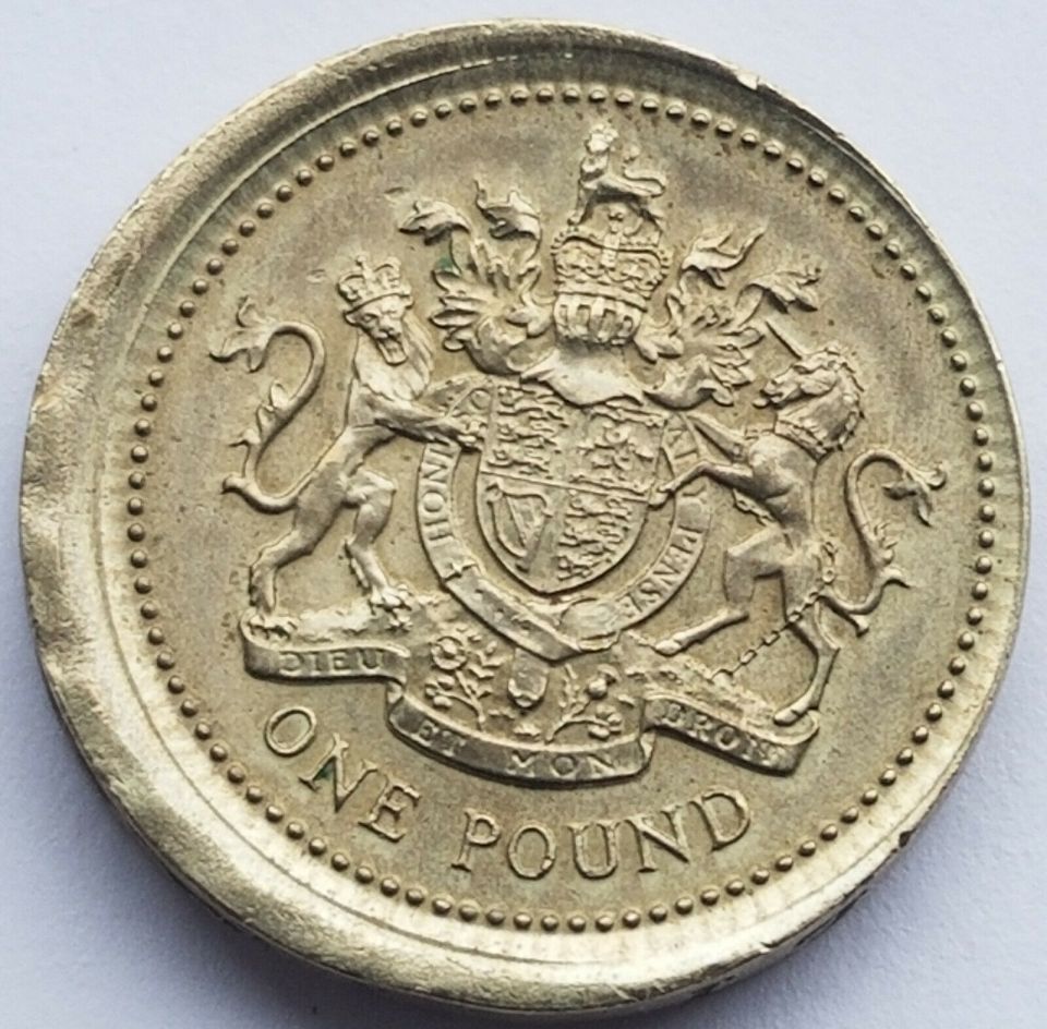 The coin looks a bit like someone's missed the mark with a cookie cutter and botched the alignment