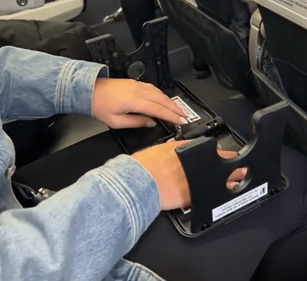 A woman went to extreme lengths for comfort by taking a fold-out footstool with her on a flight