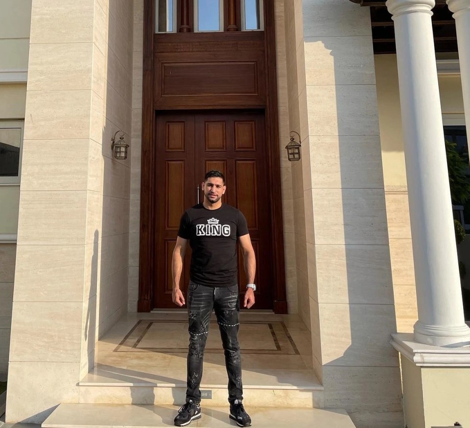 Khan stands at the door of his new palace