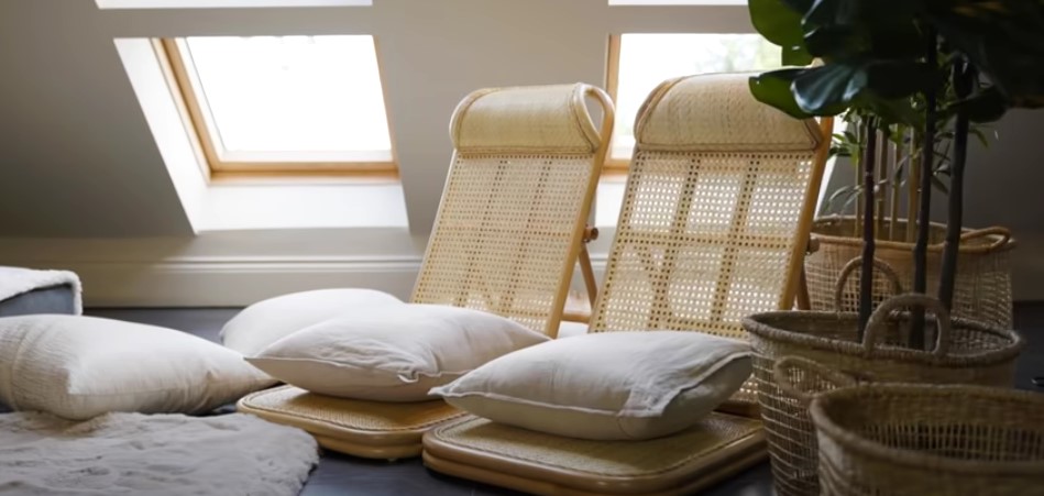 The seating area features rattan deckchairs