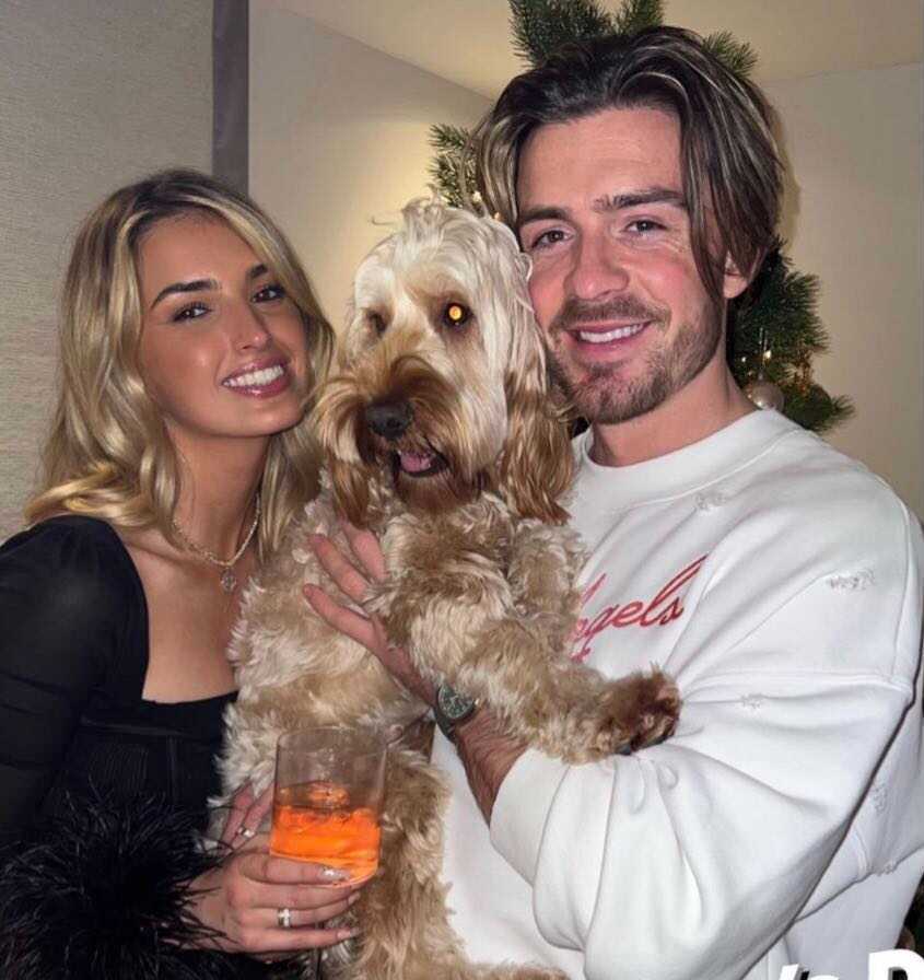 Sasha and Jack pose with her dog