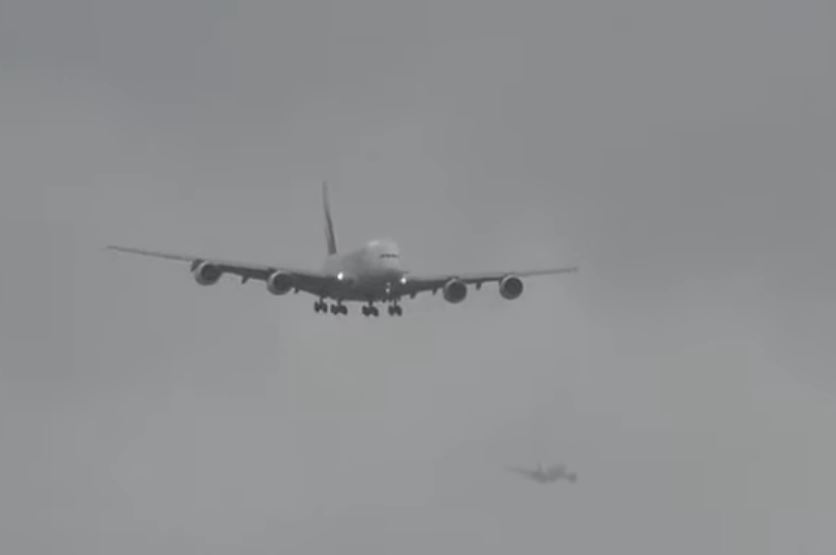 Two planes approaching the runway at Heathrow Airport