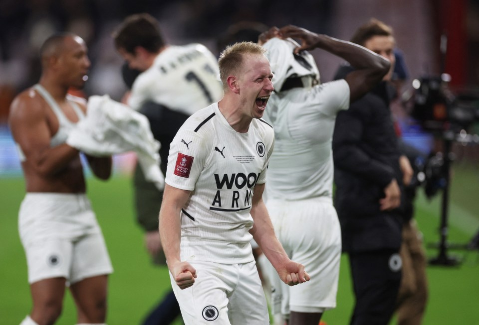 Boreham Wood players and supporters celebrated together at the final whistle