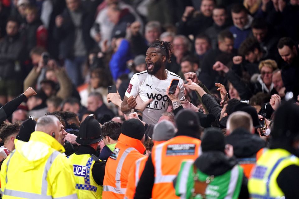 Players celebrated with joyous fans at the final whistle