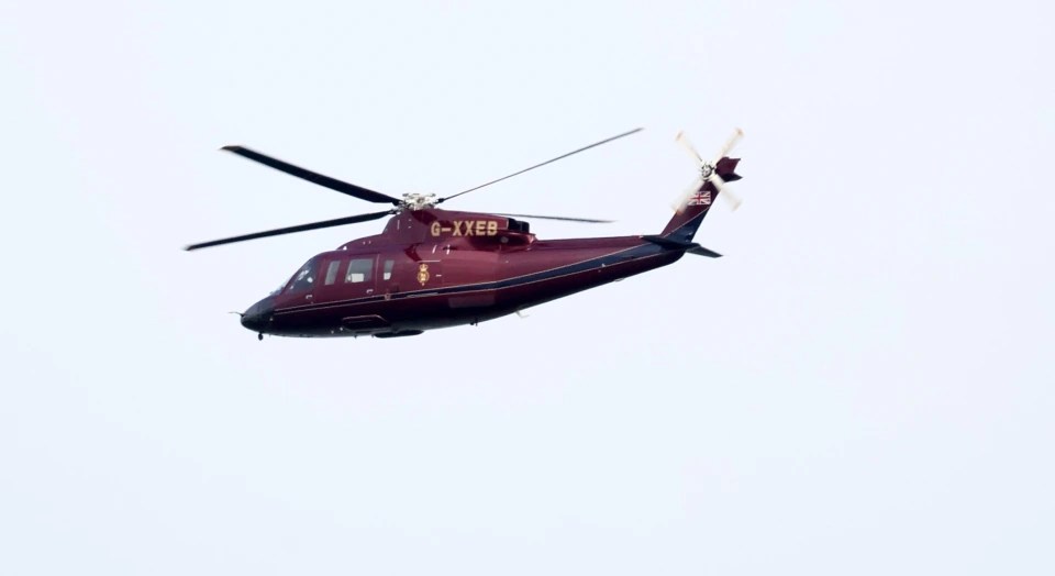 The Queen arriving at Windsor from Sandringham by helicopter