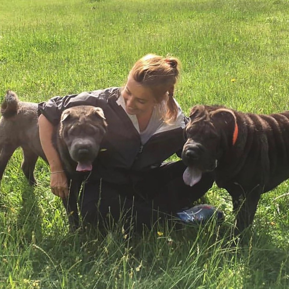 Louise pictured with her two dogs Bluebell and Rudi