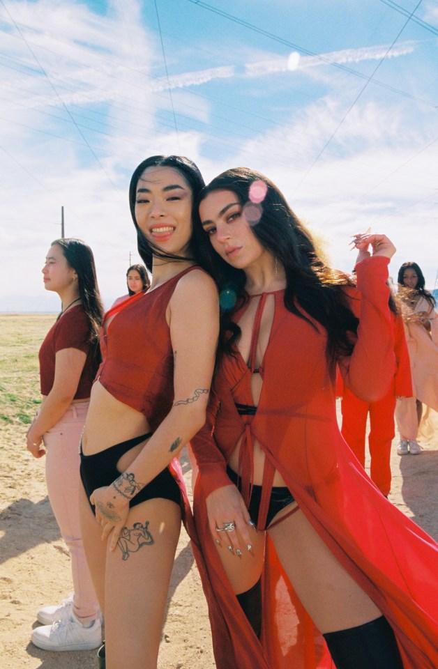 Charli XCX looks red hot in the new video for Beg For You with Rina Sawayama