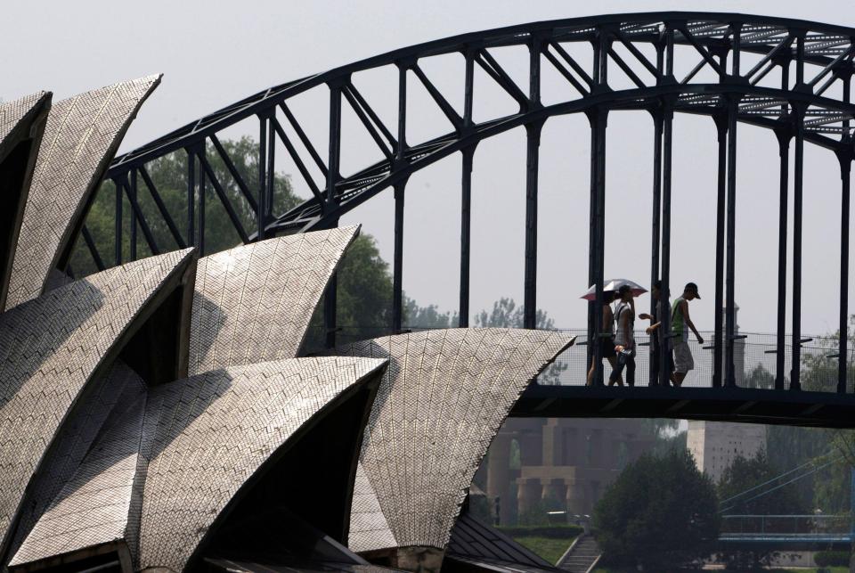 Visitors to Beijing's World Park walk across a replica of the Sydney Harbour Bridge