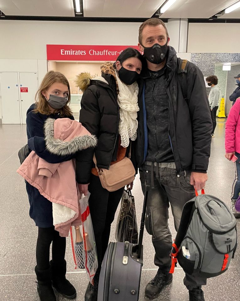 A British family arriving at Gatwick airport after returning from the Ukraine