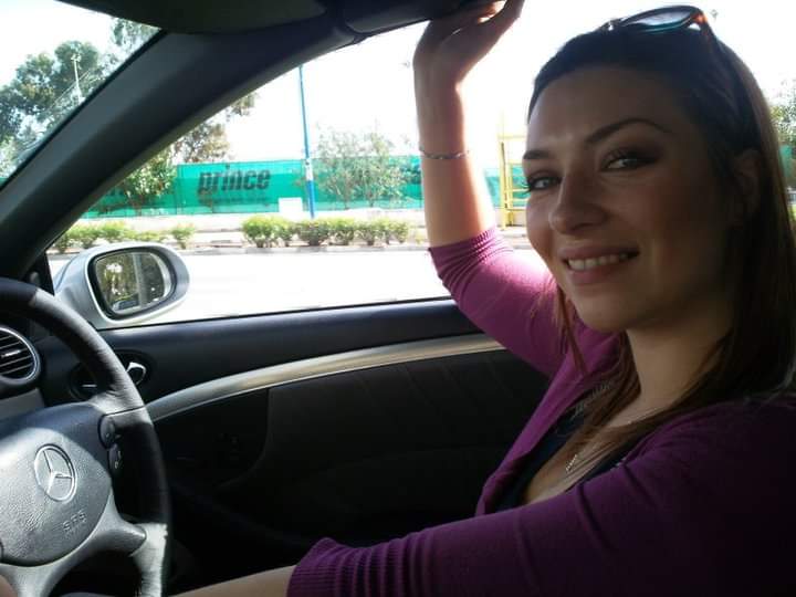 Courtney with the car she hired for Leviev while employed as his personal assistant