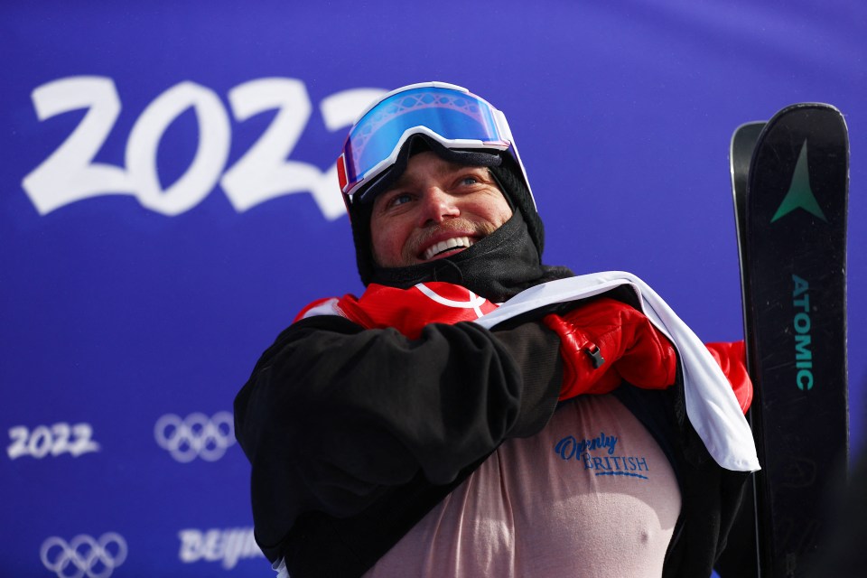 Gus Kenworthy reacts after his run