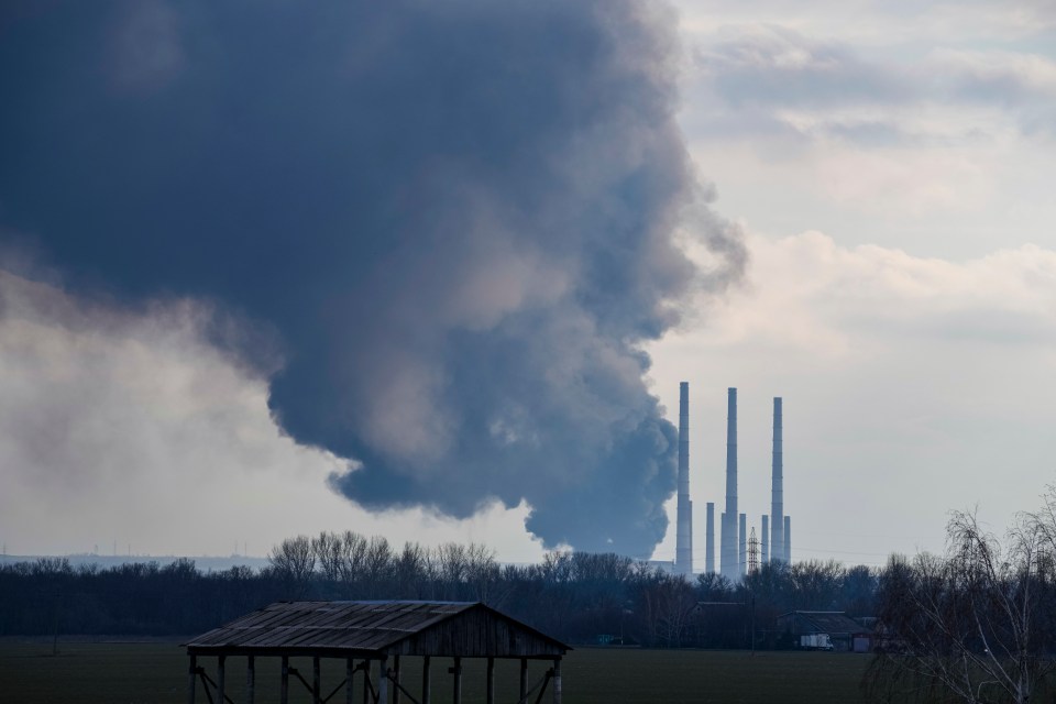 Smoke billows from a power and heating plant after it was shelled in Shchastya, Ukraine