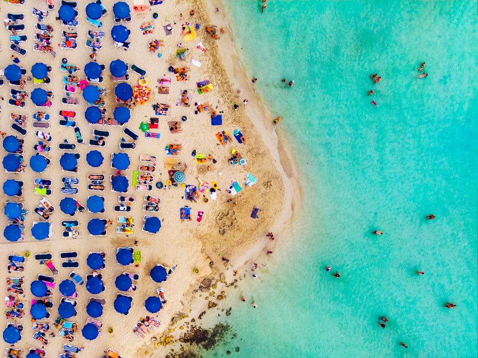 The shallow waters of Nissi Beach make it perfect for families and you can even walk out to a tiny island just off shore