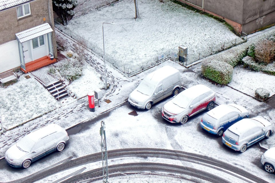 Snow covered cars in Glasgow, Scotland, today