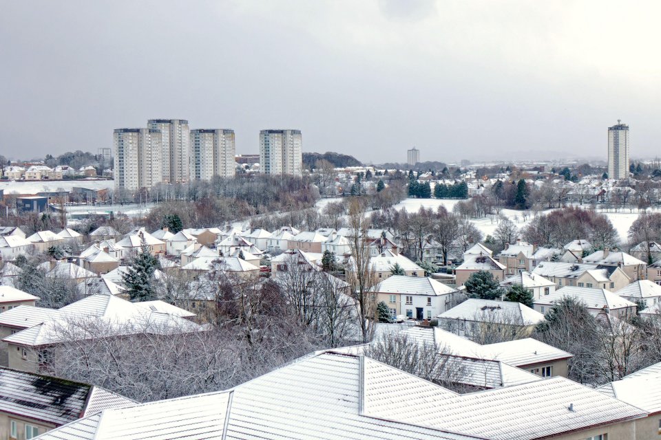 Snow covers the cityscape in Glasgow