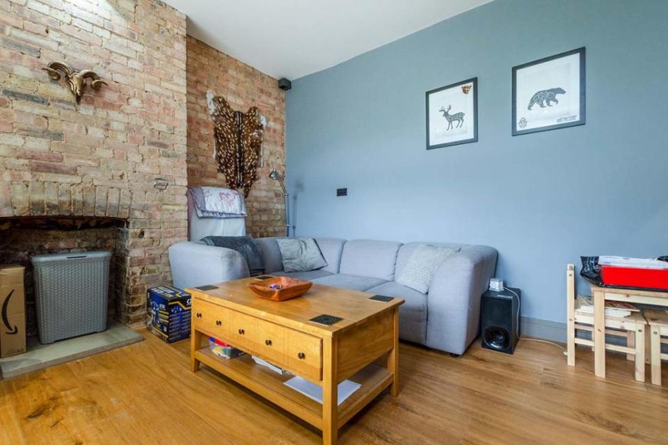 It comes with a fireplace encased within a distressed brick wall that wouldn’t look amiss in a New York loft apartment