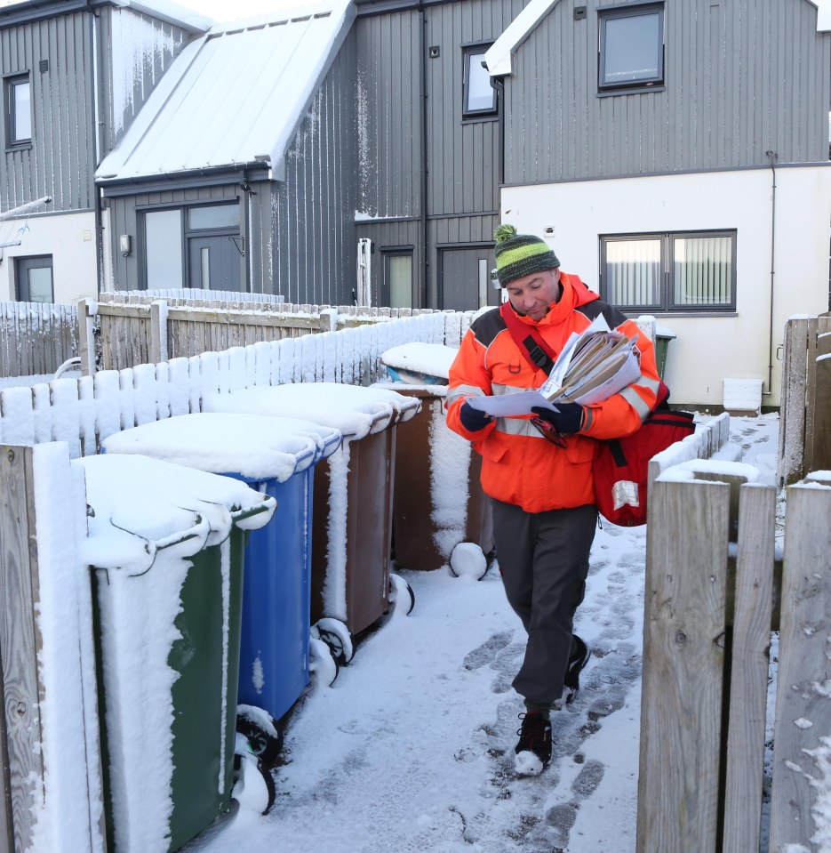 A postie out in the cold this morning in Inverness