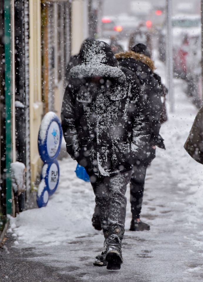 Shoppers struggle through blizzard conditions in Whitburn in West Lothian