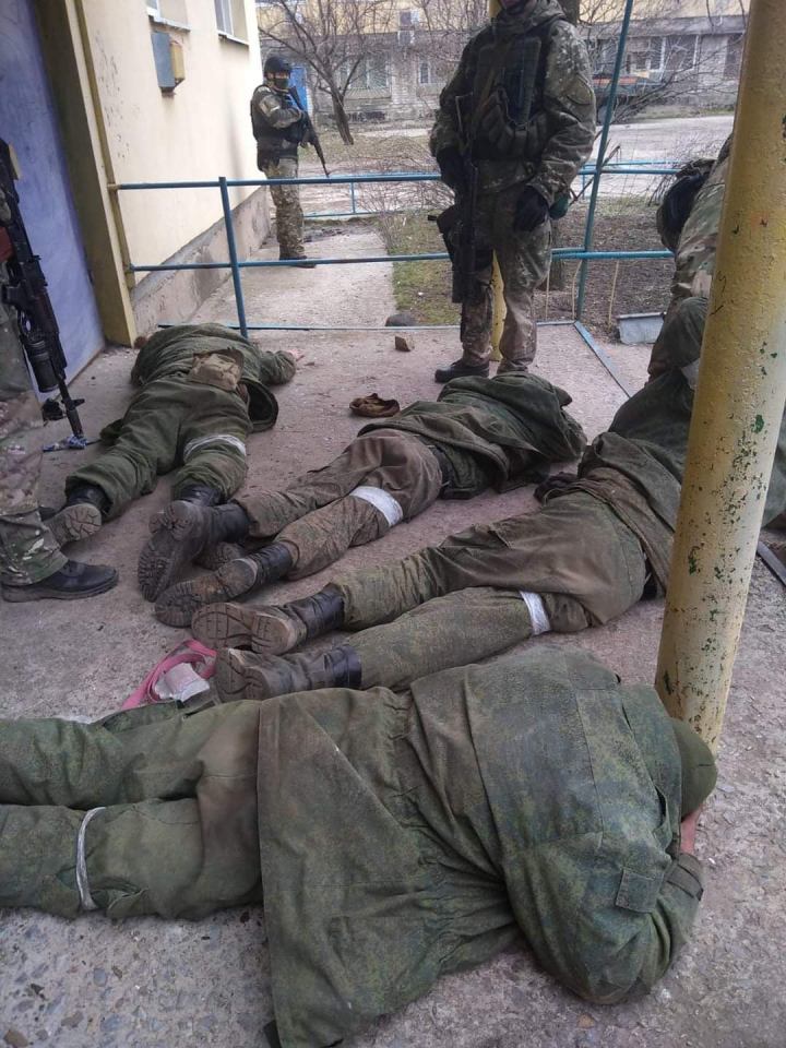 A four-strong tank crew were made to lie face down with their jackets pulled over their heads after Ukrainian troops took their BMP fighting vehicle