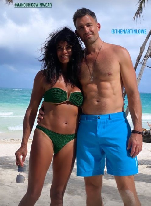 Jenny could be seen posing alongside Martin on a Mexican beach