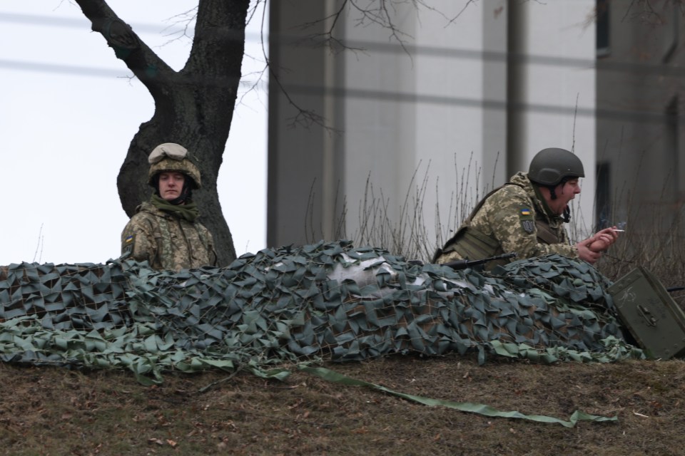 Two soldiers take a break in the calm before the storm