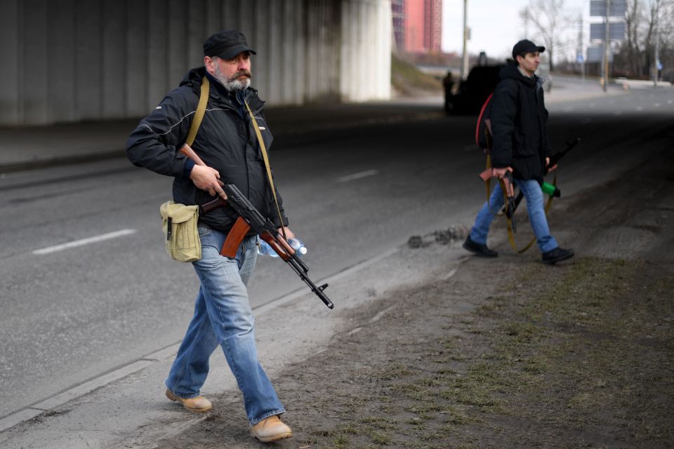 In the capital authorities rushed to hand out 10,000 assault rifles and 18,000 sub-machine guns to volunteers ready to face down the Russian invaders