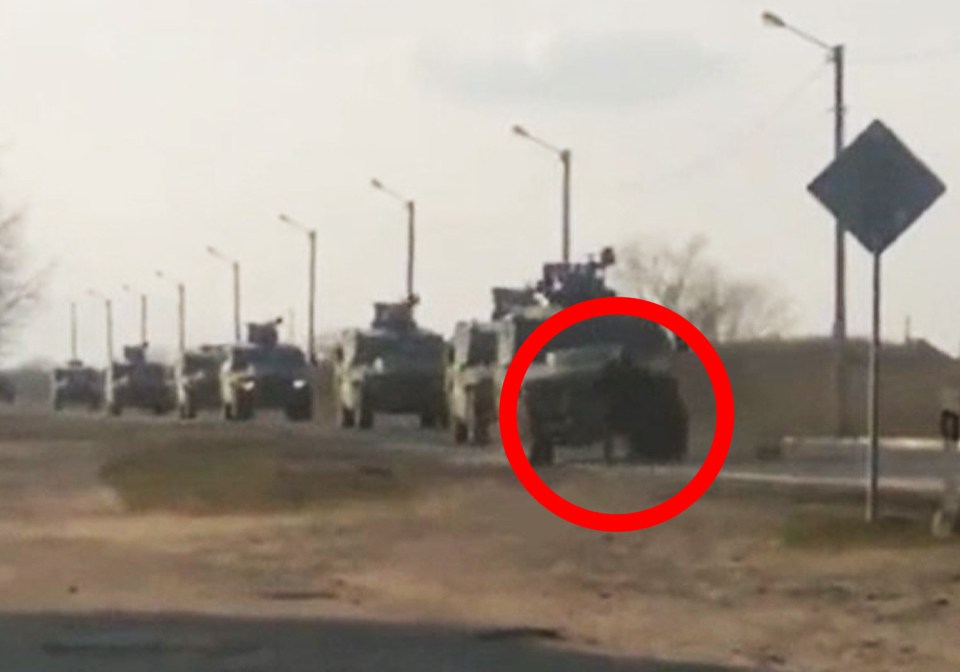 The fearless man attempts to stop the armoured vehicles packed with Russian invaders